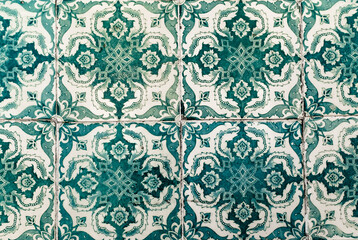Fototapeta premium Portuguese traditional tiles Azulejos with green floral pattern on a white background.