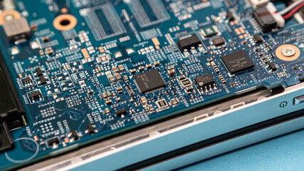 Close up laptop without cover inside disassembling in repair shop. Computer service engineer...