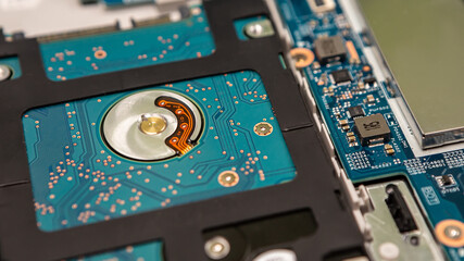 Close up laptop without cover inside disassembling in repair shop. Computer service engineer...