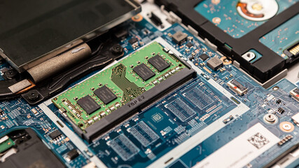 Close up laptop without cover inside disassembling in repair shop. Computer service engineer...