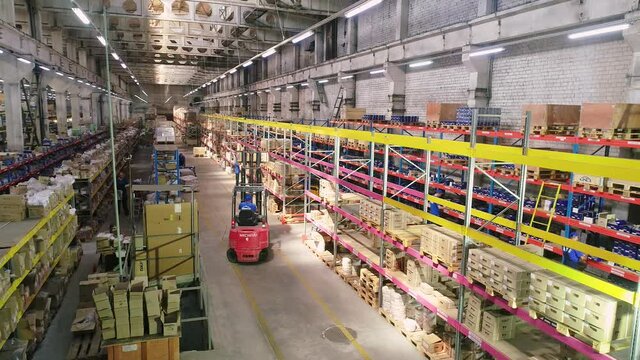 Work forklift in a modern warehouse. Industrial interior. Forklift in the warehouse.