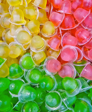Pile of colorful jelly cup snacks at hypermart food
