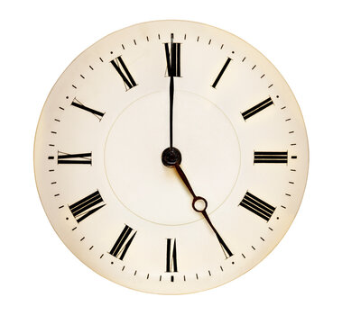 Tea Time concept. Antique clock face pointing at five o'clock against white background. Roman numerals