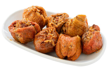 Dried peppers stuffed appetizer (mezze) isolated on a white background. Healthy vegan food. Local name kuru biber dolması