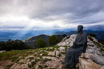 Spring sunset in Santuari Mare De Deu Del Mont peak, La Garrotxa, Spain