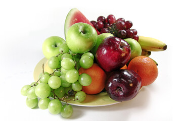 A variety of fresh fruit on one plate.