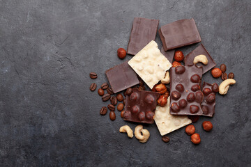 Various chocolate pieces, coffee beans and nuts