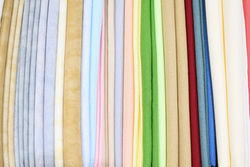 Colored fabric samples.Cloth texture background.
Bright collection of colorful textile samples.