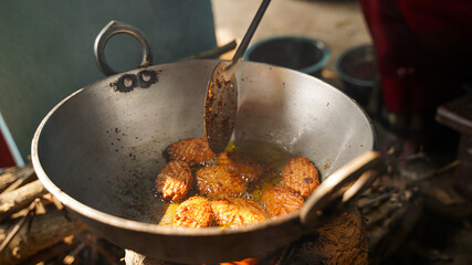 Thekua being prepared on stove before chhath puja
