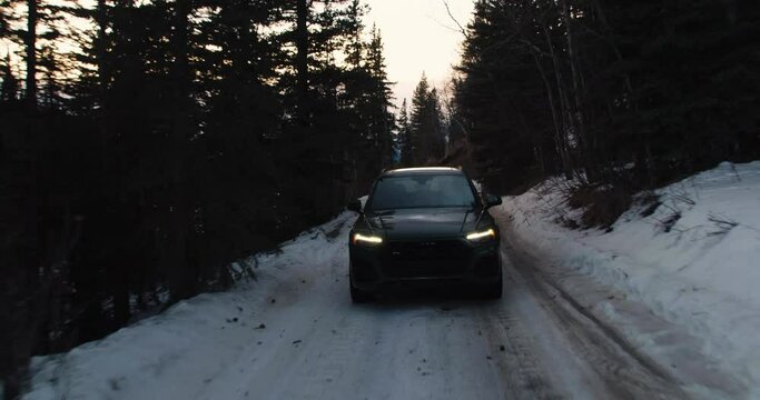 Luxury SUV driving on slush