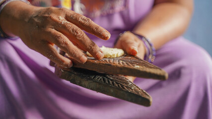 Woman making thekua for chhath puja