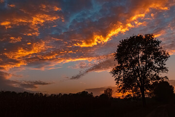 Beautiful sunset with a dramatic sky near Tabertshausen, Bavaria, Germany