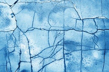 Texture of cracked cement wall in blue. Blue large grunge textures and backgrounds  