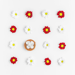 Creative layout composition of flowers and easter eggs on pastel background.