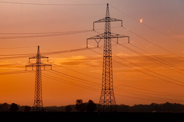 Fototapeta premium Beautiful sunset with overland high voltage lines near Tabertshausen, Bavaria, Germany