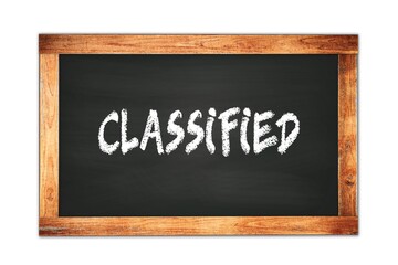 CLASSIFIED text written on wooden frame school blackboard.