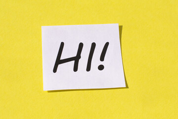 The word hi against yellow background. Greeting and welcoming in hospitality business concept.