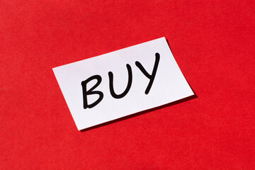 word buy on a red background. Shopping concept