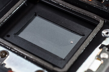 Close-up shutter covering the camera sensor, macro photography