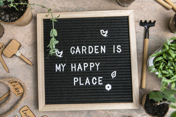 Letter board with text Garden is my happy place. Planting seeds in Biodegradable paper eco-friendly...