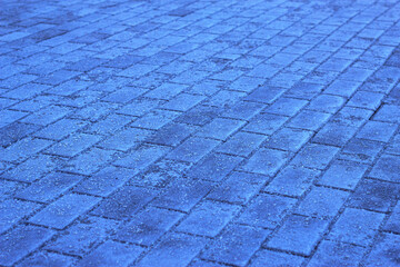salted and frozen city pavement pattern -  textured blue background, city lines in winter