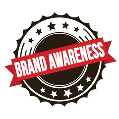 BRAND AWARENESS text on red brown ribbon stamp.