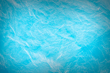 Close up texture of a blue wrinkled plastic garbage bag. Texture of cellophane.Abstract artistic...