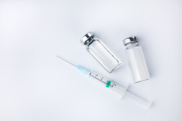 Syringe injection, vaccine vial and medicine drug bottles and on a white background. Vaccination,...