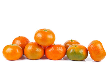 Pile of ripe juicy orane (clemetine ) isolated on a white background