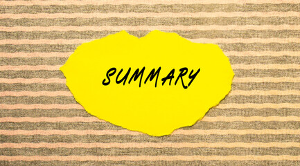 Yellow torn paper with the text SUMMARY on a gray-pink background.