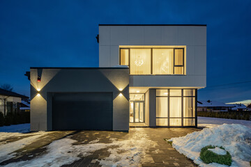 Exterior of luxury private house. Modern cottage at evening.