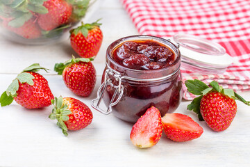 Bowl of strawberry jam isolated on white background from top view