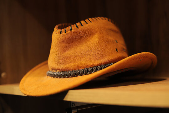 Brown cowboy hat on the shelf