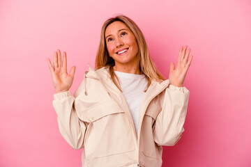 Young mixed race woman isolated on pink background joyful laughing a lot. Happiness concept.