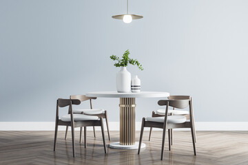 Modern white round dining table with wooden chairs around in stylish room with parquet and light...
