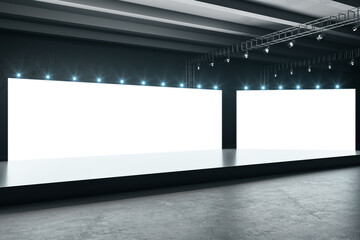 Two white blank big borads in empty hall with black podium, lights on top and dark concrete floor....