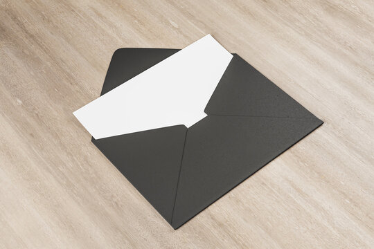 Black Envelope With White Blank Card On Wooden Table. Mock Up