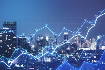 Smart city and stats concept with growing digital graphs and diagram at abstract night city background