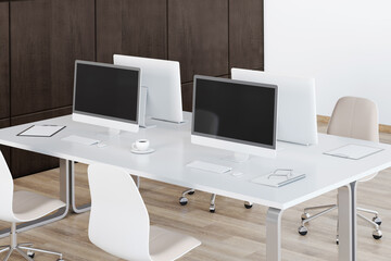 Sunny work space in modern style office with white furniture: tables and chairs and wooden wall and floor