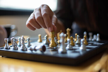A woman sitting in chess May be interpreted in the planning of the competition in the business.