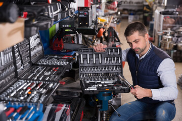customer is choosing ratchet in tools store.