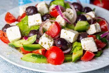 Greek salad with fresh vegetables, feta cheese and kalamata olives. Healthy food.