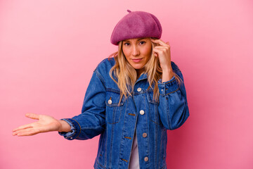 Young mixed race woman isolated on pink background showing a disappointment gesture with forefinger.