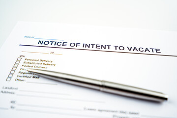 Notice of intent to vacate letter and pen.