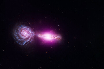Two connected galaxies. Elements of this image were furnished by NASA.