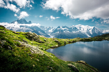 Mighty Mont Blanc glacier with lake Lac Blanc. Location Chamonix resort, France, Europe.