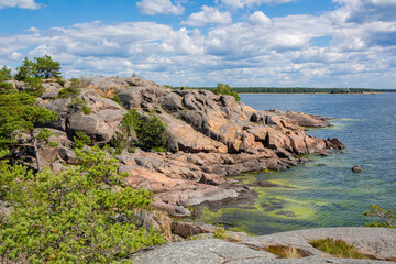 Fototapeta na wymiar View of the rocky shore of Puistovuori, Hanko, Finland