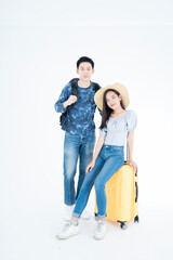 Fototapeta na wymiar Young couple packing for vacation travel on isolated. Young Asian man and women are preparing for the journey happily on white background.
