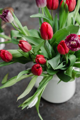 Red tulips in a vase close up