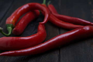 hot chili peppers red wooden table cooking food ingredients